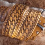 Leather belt decorated with toolpaw stamps